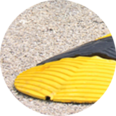 TreeTop Speed Bump on pavement” class=
