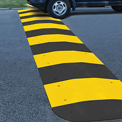 Car going over speed hump.